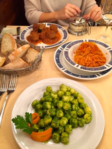 Meatballs with marinara and pasta; gnocchi with pesto.